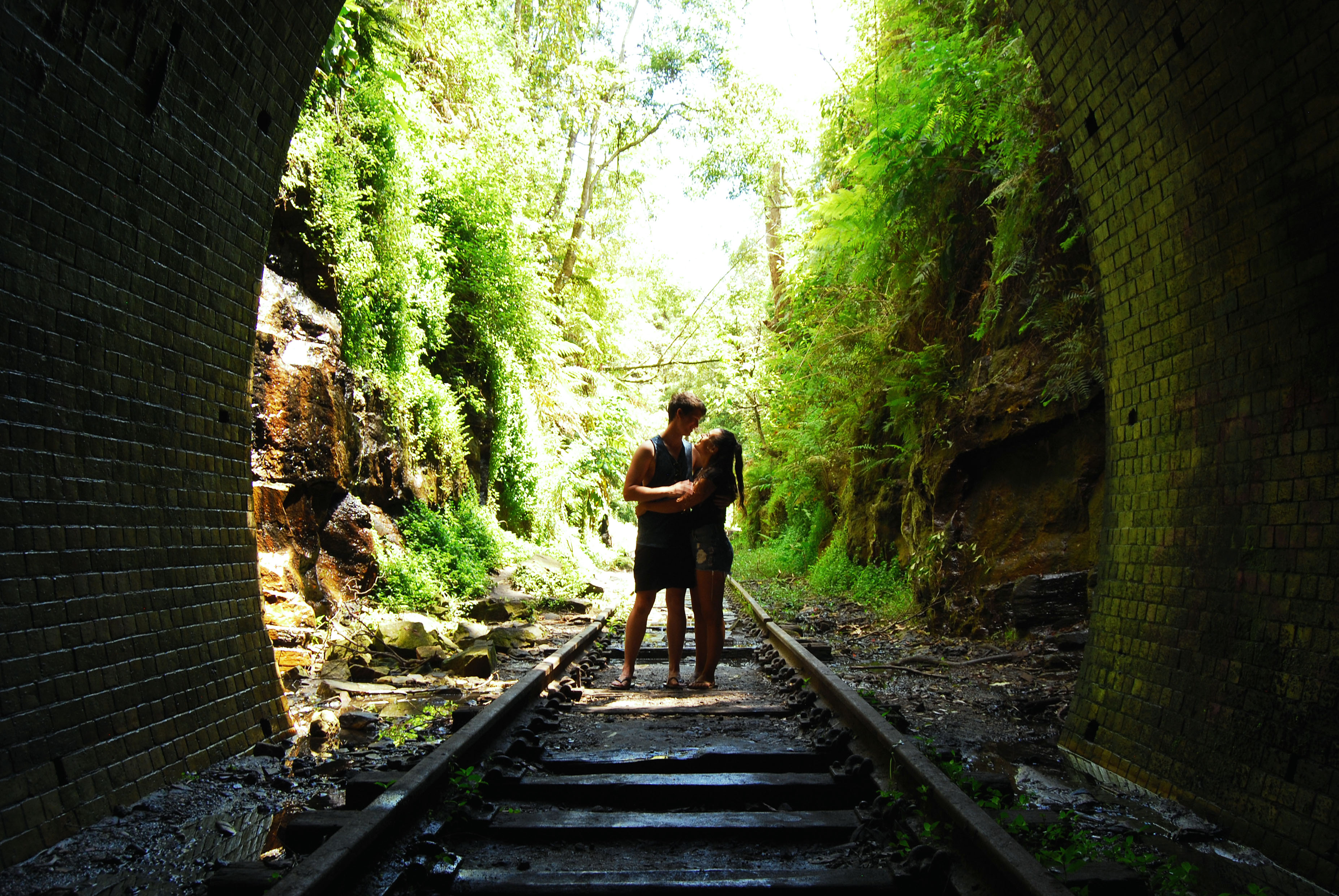 Emma and Joel on train tracks